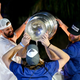 Alex Killorn and Steven Stamkos pour beer from the Stanley Cup into the mouth of Victor Hedman of the Tampa Bay Lightning during the 2020 Stanley Cup Champion rally in Tampa.